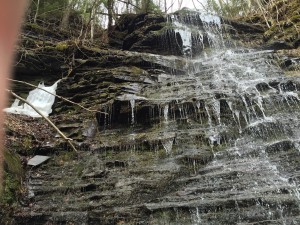 Waterfall with an ice block still visible.