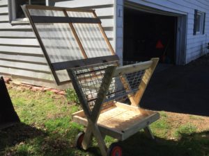 Goat feeder with the roof open.