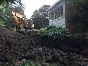 Another view of the moat with the backhoe.